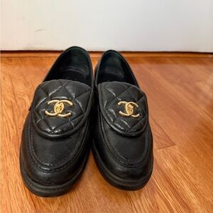 CHANEL Black Leather Loafers with Gold Accents